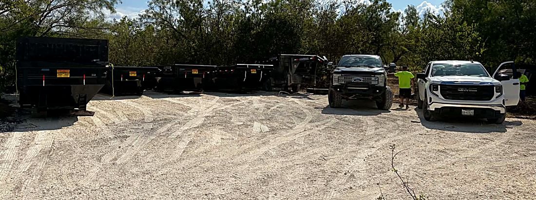 Row of Ground Zero dumpsters and trucks at the yard